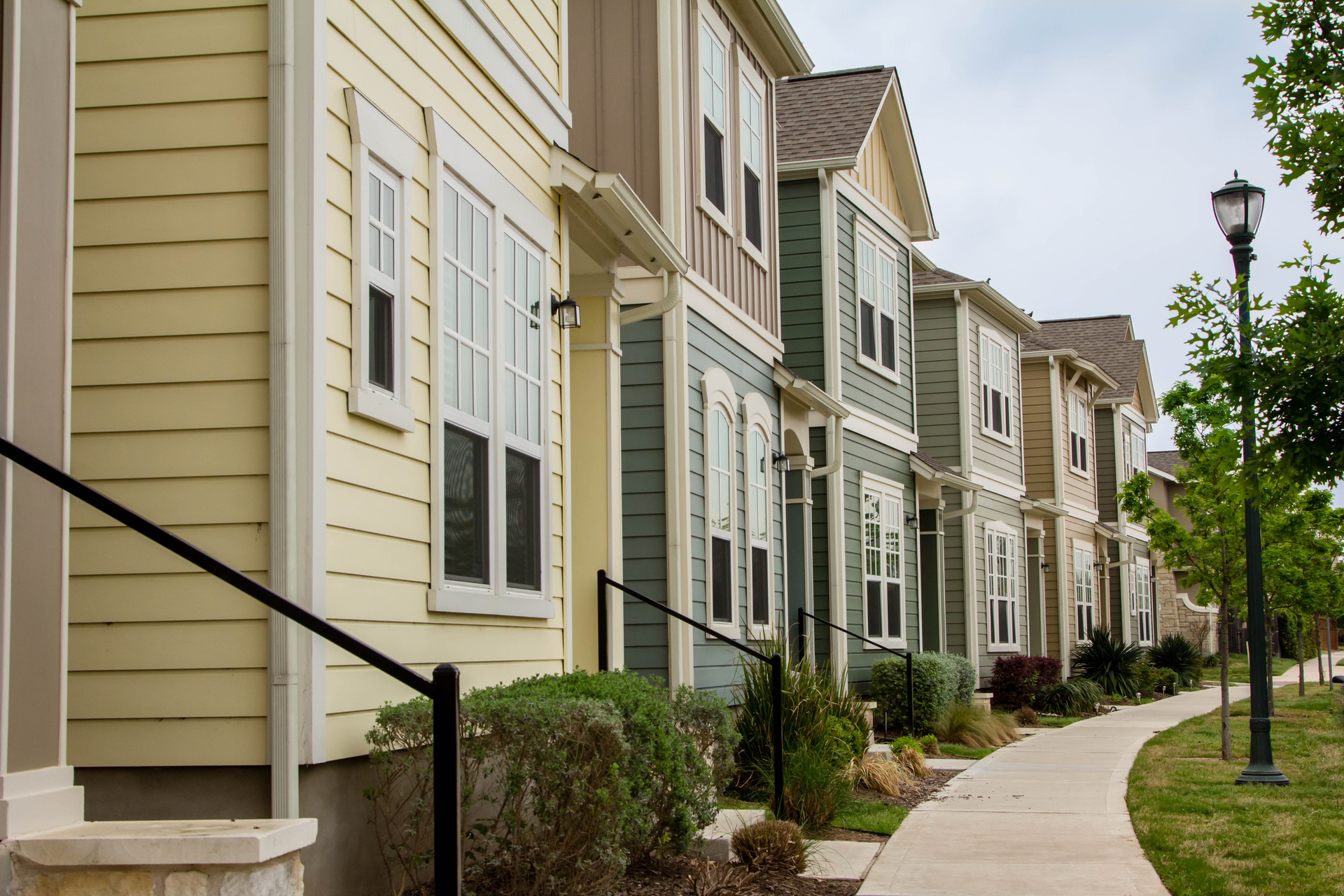 Row of Austin townhomes along a tree-lined street
